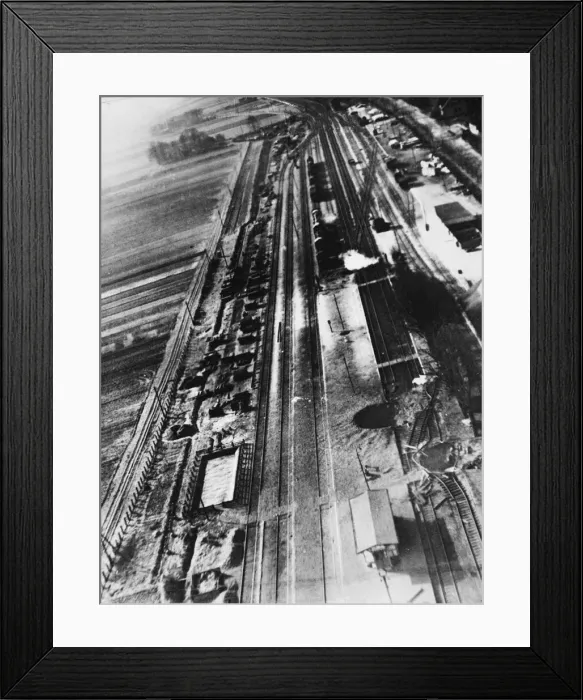 Framed Print : Bomb craters can be seen severing the central platform of the railway station Framed Print : Bomb craters can be seen severing the central platform of the railway station