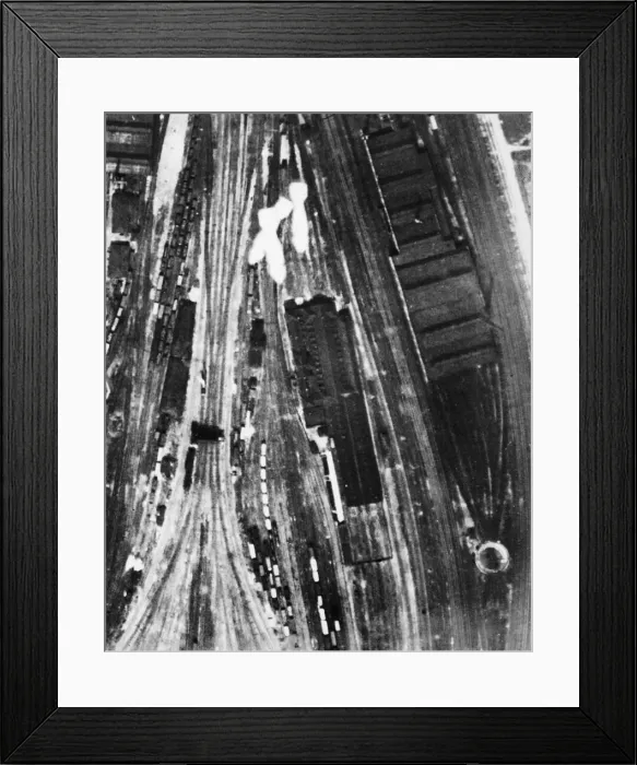 Framed Print : Bombs from a Bristol Blenheim of No. 2 Group fall over the junction of the main lines