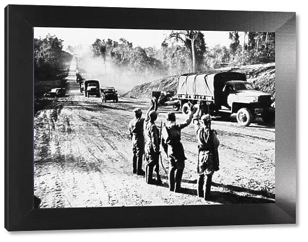 Chinese soldiers on the Stillwell road in Myitkyina during Second World War wave to