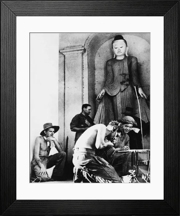 Framed Print : Radio Telephonists at work beneath a gigantic idol in whose Temple a command post has