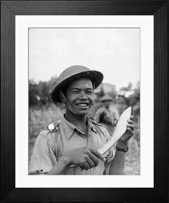 Framed Print : A Gurkha infantryman armed with a kukri prepares for a night patrol. Italy Framed Print : A Gurkha infantryman armed with a kukri prepares for a night patrol. Italy
