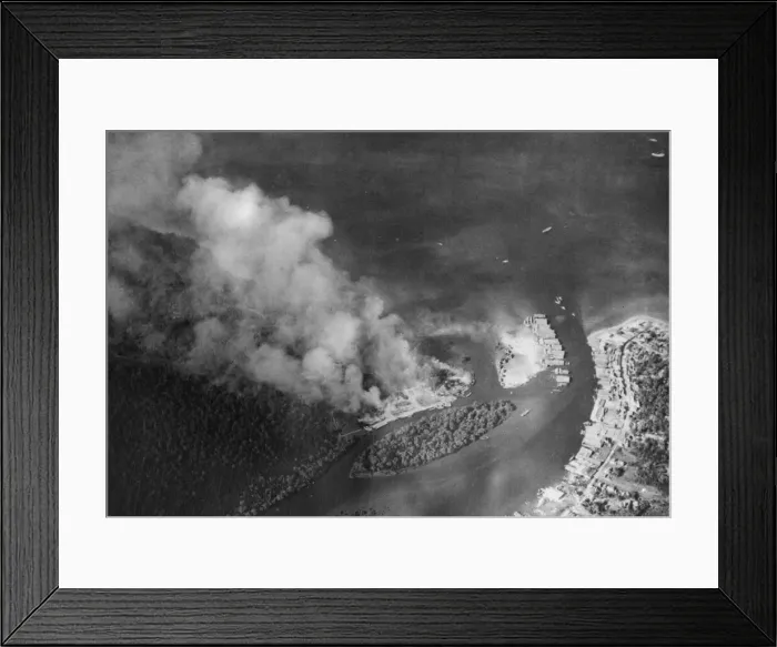 Framed Print : The trans-shipment base at Chumphon on the Kra Isthmus ablaze during a raid by RAF Framed Print : The trans-shipment base at Chumphon on the Kra Isthmus ablaze during a raid by RAF