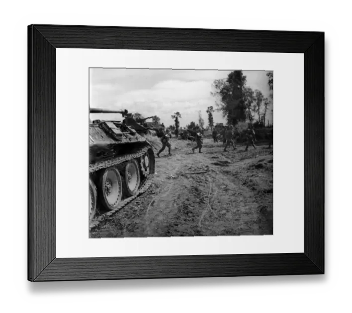 Framed Print : British infantry passing a knocked out German tank as they move up to consolidate a Framed Print : British infantry passing a knocked out German tank as they move up to consolidate a