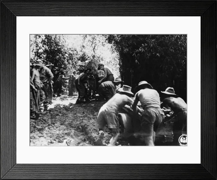 Framed Print : Jeeps and trailers of an Assault Field Regiment, 36th Division, negotiate a muddy track