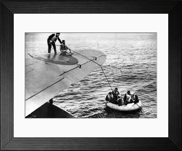 Framed Print : Dinghy drawn alongside a rescue aircraft. Circa July 1942 Framed Print : Dinghy drawn alongside a rescue aircraft. Circa July 1942