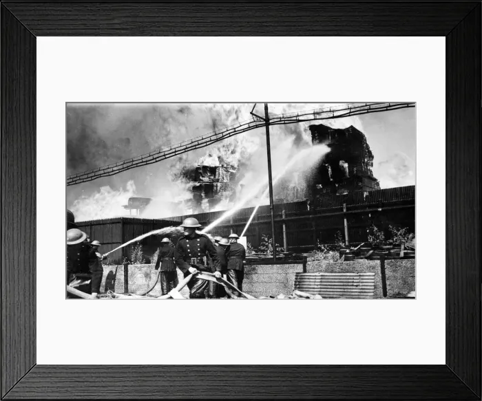 Framed Print : Timber yard fire, Walinden Road, Hackney. One section of the timber stacks shown burning Framed Print : Timber yard fire, Walinden Road, Hackney. One section of the timber stacks shown burning