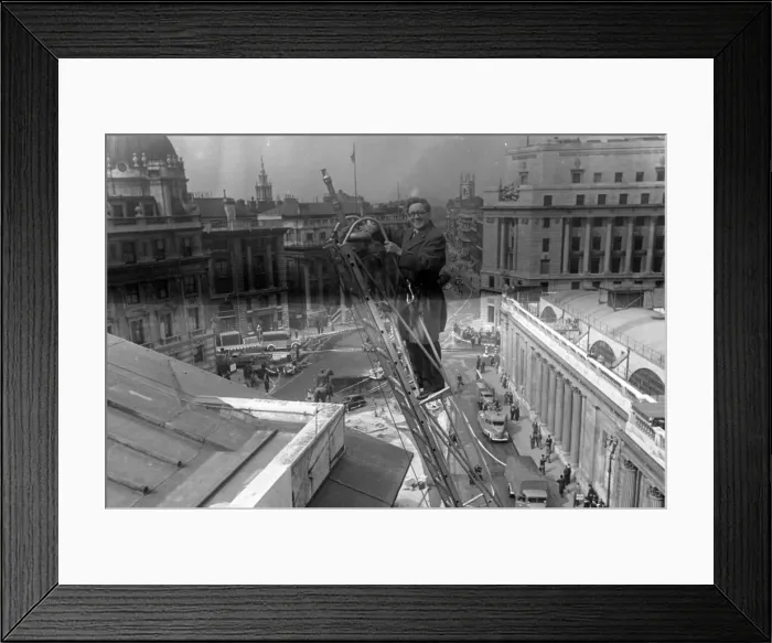 Framed Print : Herbert Morrison, Minister of Home Security, up a ladder, London. 1942