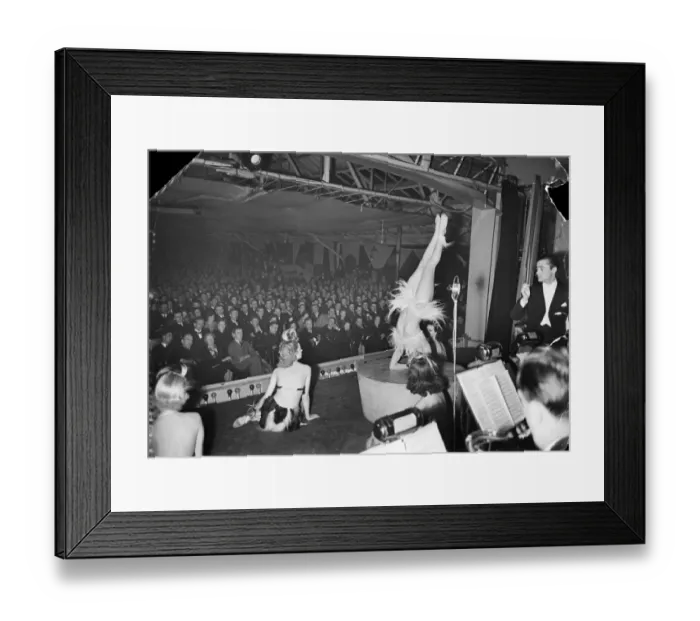 Framed Print : A lady does her acrobatic routine, entertaining the troops in one of the many organised Framed Print : A lady does her acrobatic routine, entertaining the troops in one of the many organised