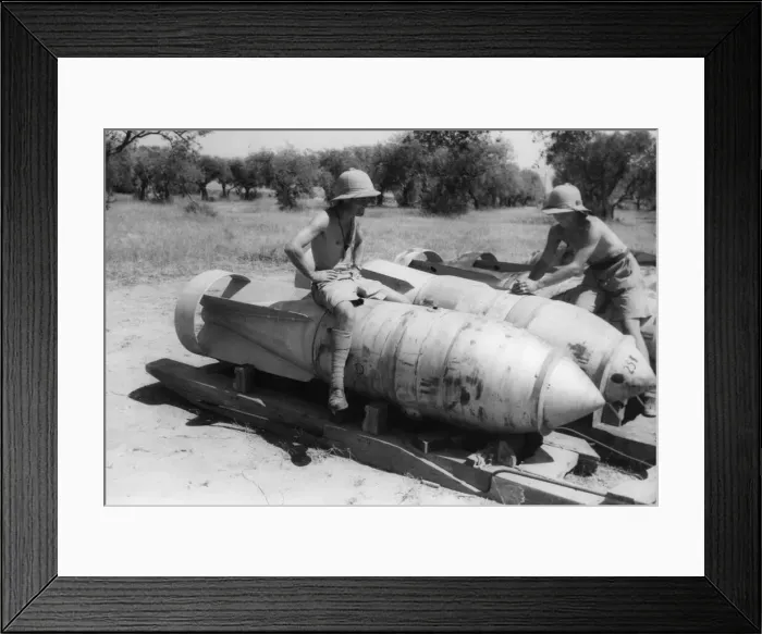 Framed Print : Army soldiers sit on a German block buster'(3000 pounders Framed Print : Army soldiers sit on a German block buster'(3000 pounders