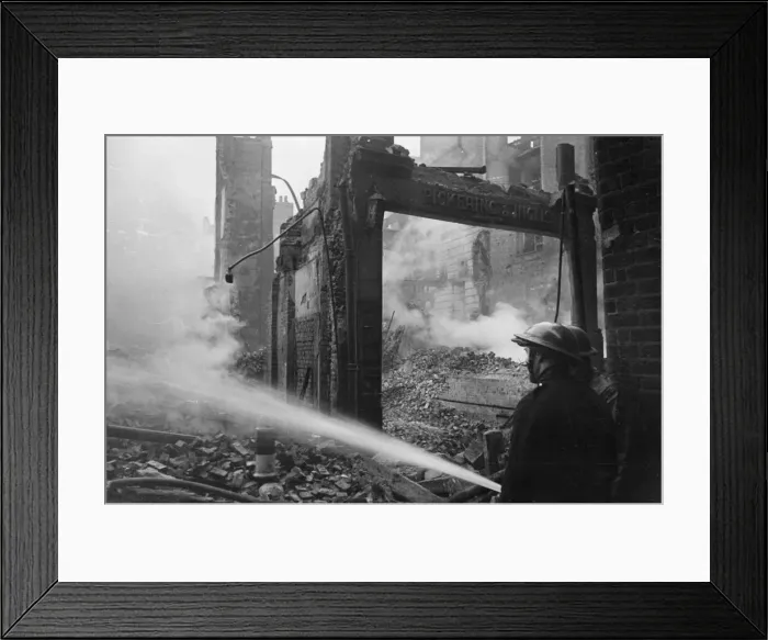Framed Print : Picture shows firemen controlling the smoulders after another fire broke out in an air Framed Print : Picture shows firemen controlling the smoulders after another fire broke out in an air