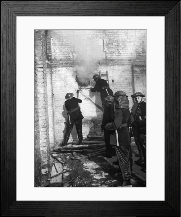 Framed Print : Members of The Auxiliary Fire Service (AFS) hard at work as walls, during World War Two Framed Print : Members of The Auxiliary Fire Service (AFS) hard at work as walls, during World War Two