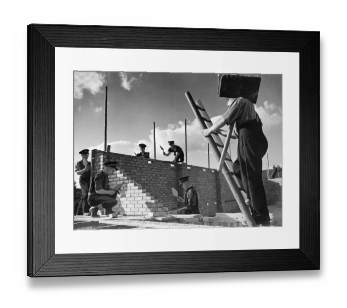 Framed Print : Members of The National Fire Service, building their own fire station