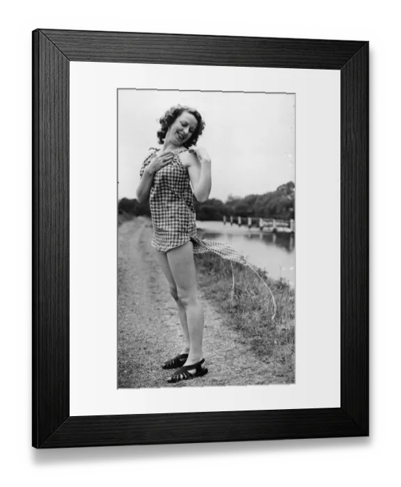 Framed Print : Making a playsuit out of odd bits of material. Gingham in this case Framed Print : Making a playsuit out of odd bits of material. Gingham in this case