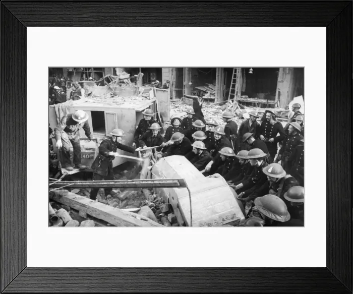 Framed Print : Fireman at a sub station in London, after it was hit in The Blitz of World War Two