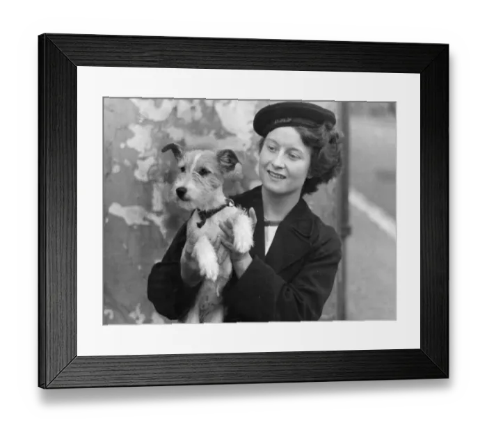Framed Print : A WREN, (The Womens Royal Naval Service) possibly called Nellie, with the puppy dog Framed Print : A WREN, (The Womens Royal Naval Service) possibly called Nellie, with the puppy dog