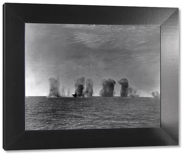 Bombs falling all around of HMS Ark Royal during an attack by Italian aircraft during