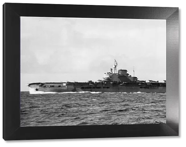 HMS Victorious on her way back from Norwegian waters with attendant cruiser