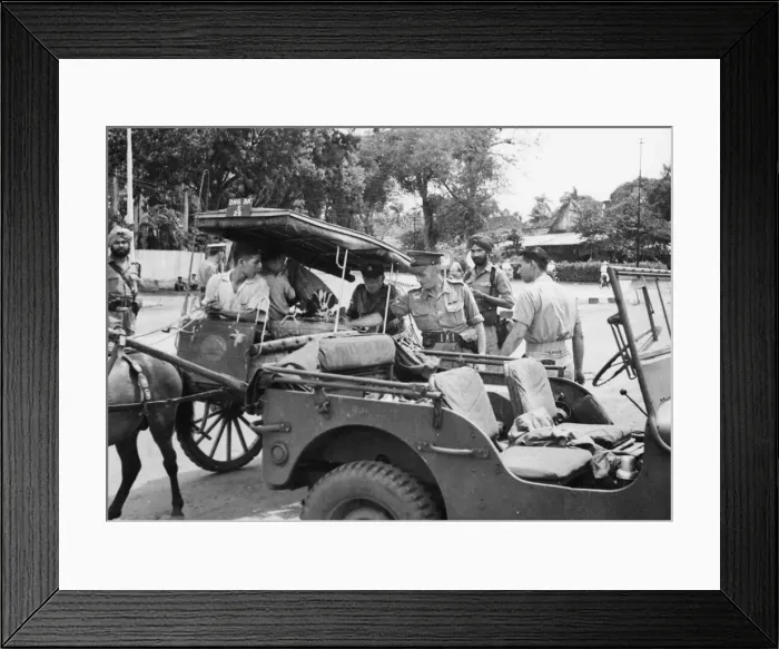 Framed Print : British Military Policemen search an Indonesian cart. Onlookers are Indian Military