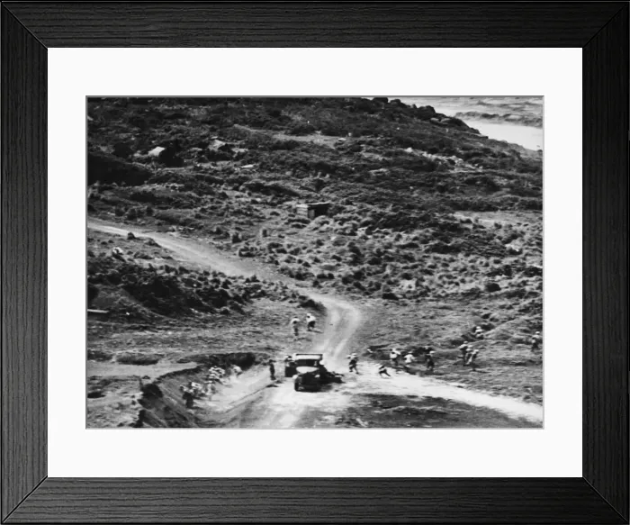 Framed Print : Japanese troops flee for safety during an American air attack on Iwo Jima during Second
