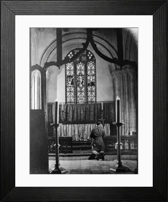 Framed Print : Airman of the 8th Army prays at a church in England. December 1943 Framed Print : Airman of the 8th Army prays at a church in England. December 1943