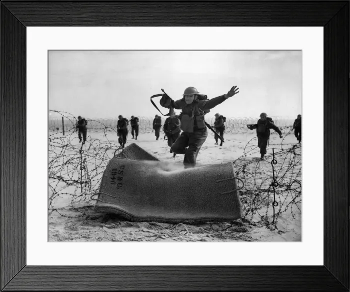 Framed Print : Pictured, men of the Suffolks in a sea shore exercise practice the crossing barbed wire Framed Print : Pictured, men of the Suffolks in a sea shore exercise practice the crossing barbed wire