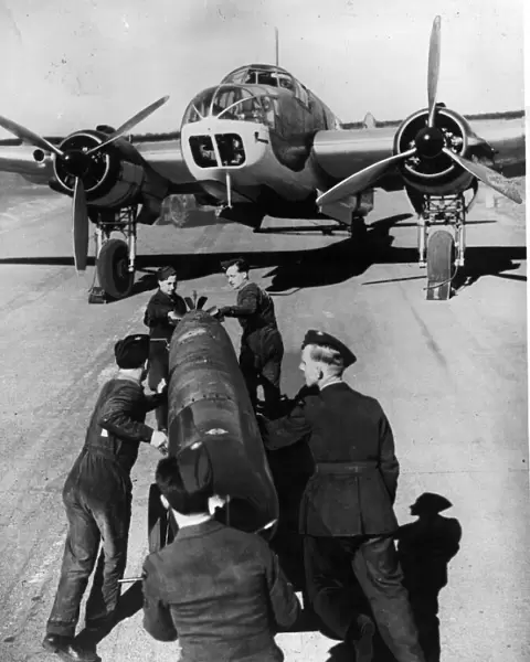 Loading a torpedo onto a Beaufort bomber at a Coastal Command station in Scotland