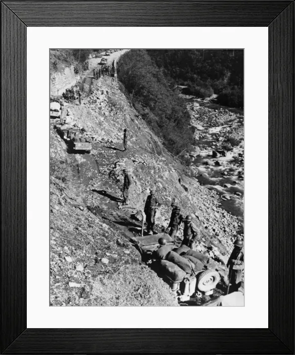 Framed Print : Cautiously, their guns ready for quick action, American troops push through the heavy Framed Print : Cautiously, their guns ready for quick action, American troops push through the heavy