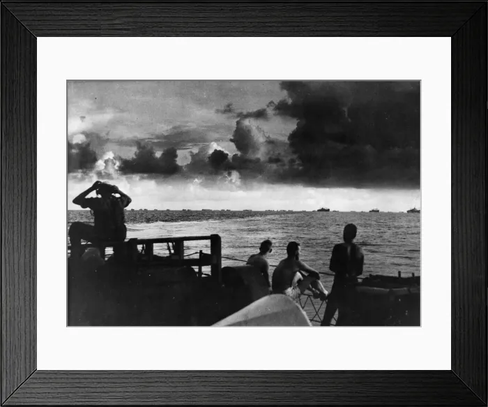 Framed Print : Seamen on the deck of the US Coast Guard Frigate watch a large caravan of ships