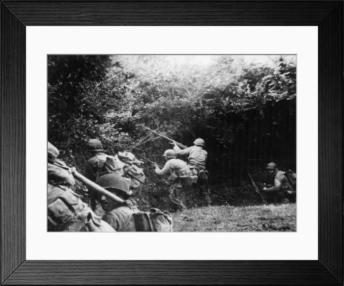 Framed Print : US infantrymen, fired at by an enemy German sniper, take to the ditch Framed Print : US infantrymen, fired at by an enemy German sniper, take to the ditch