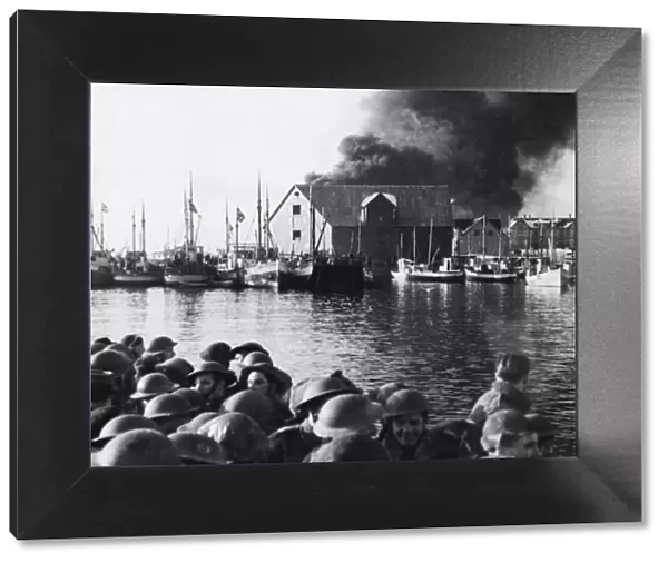 Commandos sail for home as a Stamsund objective burns. Circa 1940s