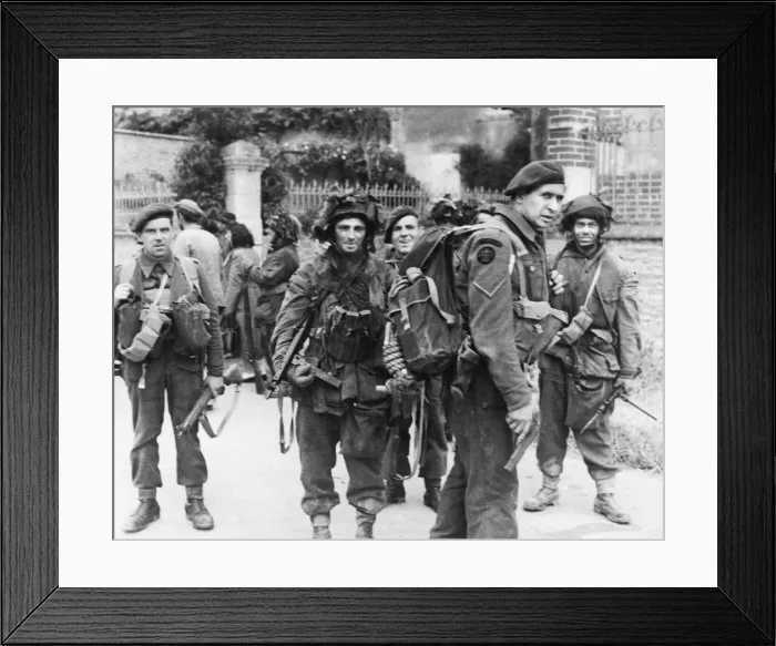 Framed Print : Commandos pause during cleaning up of village during WWII. Circa 1940s Framed Print : Commandos pause during cleaning up of village during WWII. Circa 1940s