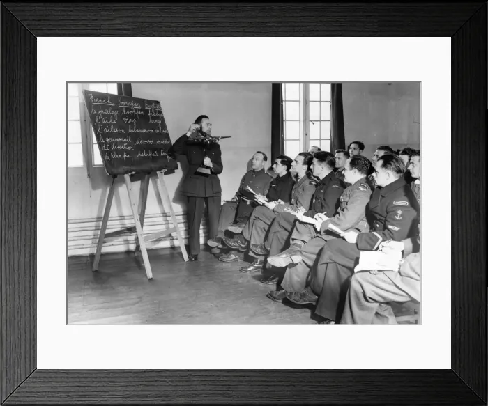 Framed Print : A Royal Air Force class for allied solders. The teacher holds up a plane Framed Print : A Royal Air Force class for allied solders. The teacher holds up a plane