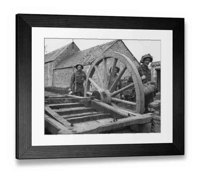 Framed Print : Soldiers of the 49th Division Passing a wrecked farm cart near Rauray 29th June 1944 Framed Print : Soldiers of the 49th Division Passing a wrecked farm cart near Rauray 29th June 1944