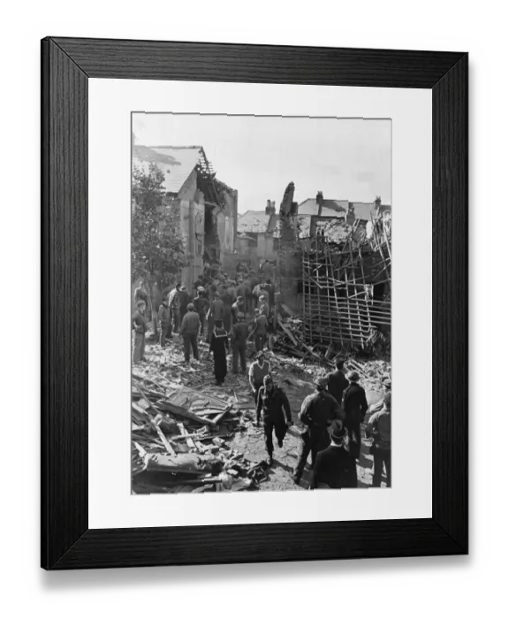 Framed Print : A bomb damage scene. Folkestone in Kent. The house is in ruins in the background