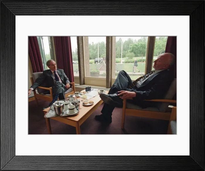 Framed Print : Journalist and writer, Harold Evans (left) talking to a journalist. 1st July 1998