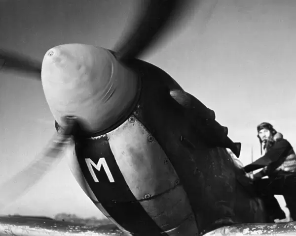 Sergeant S. W. Loader of New Barnet climbs into his Spitfire to join a Channel sweep