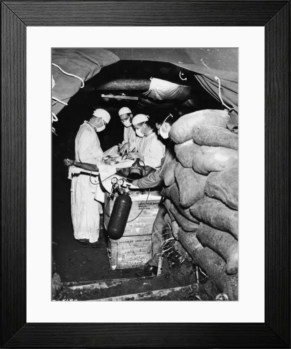Framed Print : Units of the US Army Medical Corps in combat areas perform their duties under extreme