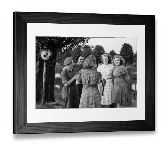 Framed Print : Two British soldiers chat to German women by a river bridge. June 1945 Framed Print : Two British soldiers chat to German women by a river bridge. June 1945