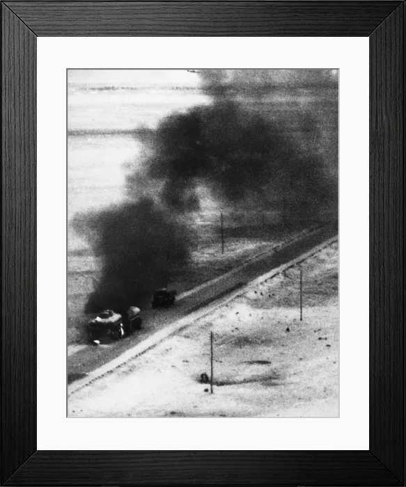 Framed Print : A tanker and trailer on fire after an attack from a Blenheim bomber during Second World Framed Print : A tanker and trailer on fire after an attack from a Blenheim bomber during Second World