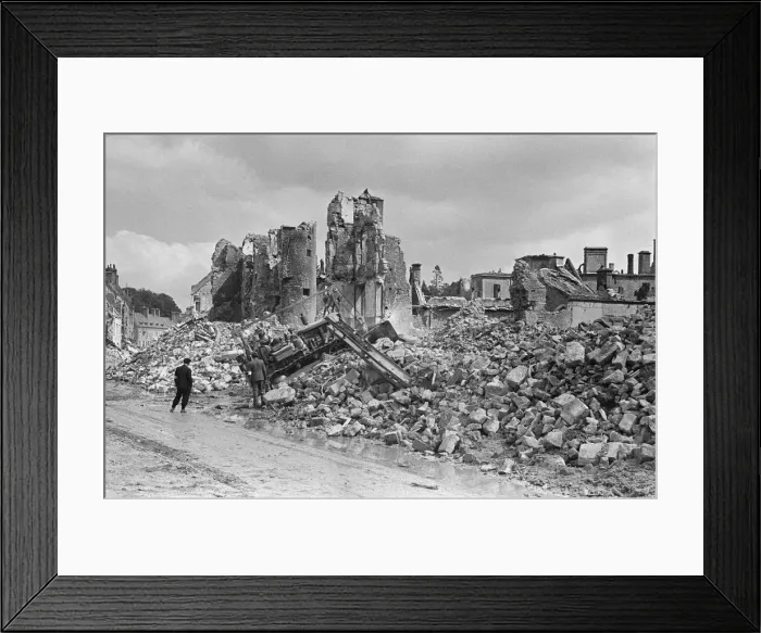 Framed Print : Ruined buildings and wrecked German transport in the streets of Montebourg as a result of
