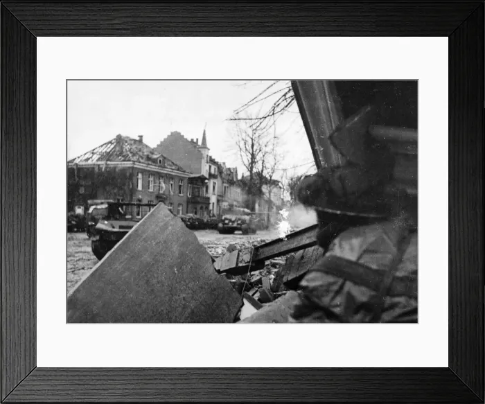 Framed Print : A British infantryman takes cover under the ruins of a building in Kleve