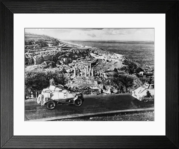 Framed Print : Armoured cars of the South African Field Force pass ancient ruins in Cyrene during Second