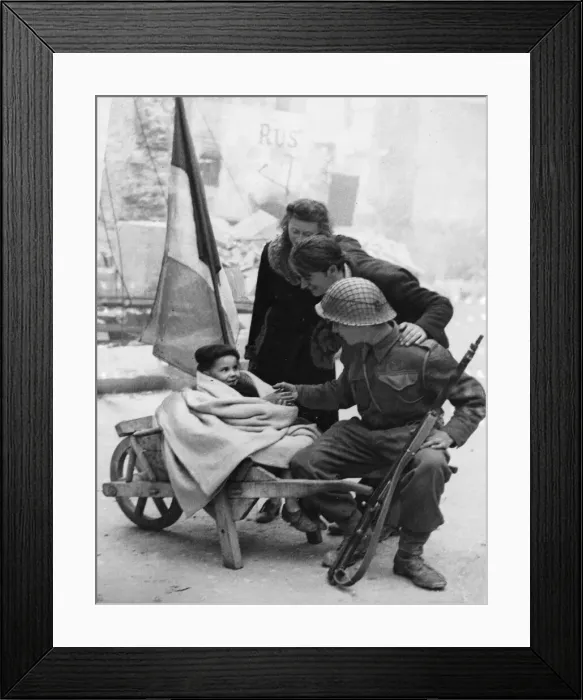 Framed Print : A British soldier of 3rd Division makes friends with a young French couple