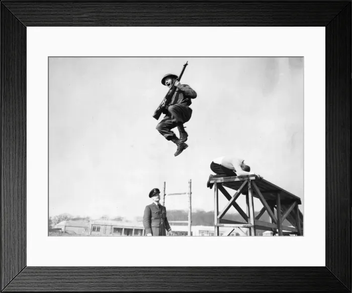 Framed Print : A flying leap before the instructor during the battle agility training demonstration of Framed Print : A flying leap before the instructor during the battle agility training demonstration of