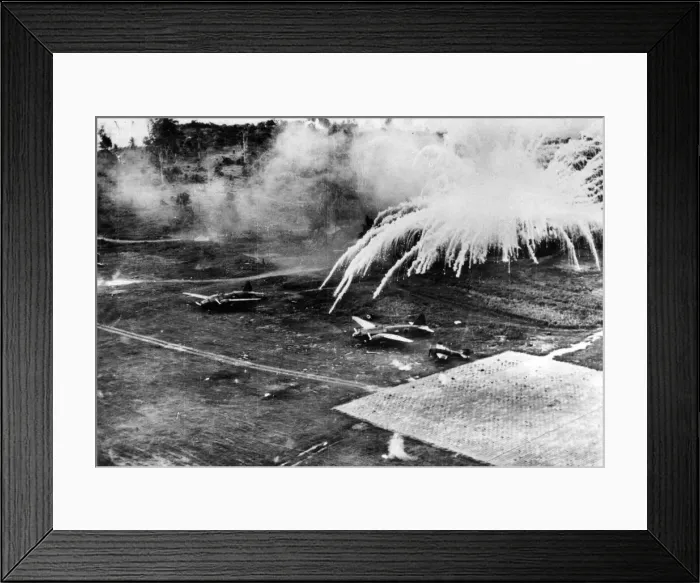 Framed Print : US planes drop phosphorous bombs over the Lakunai airfield in Rabaul, Papua New Guinea Framed Print : US planes drop phosphorous bombs over the Lakunai airfield in Rabaul, Papua New Guinea