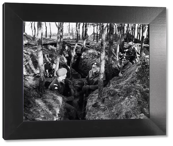 Infantry of the 1st Battalion The Suffolks in the dugouts on the banks of the River Ms