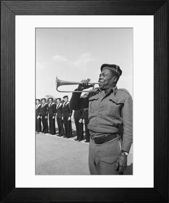 Framed Print : Free French sailors are call to parade by a bugler at their barracks in Southern England