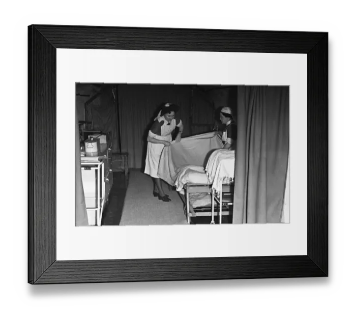 Framed Print : Nurses prepare a bed at a First Aid Post in Dover dug into the white cliffs Framed Print : Nurses prepare a bed at a First Aid Post in Dover dug into the white cliffs