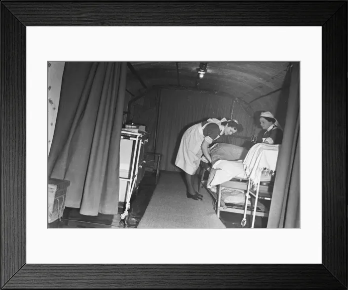 Framed Print : Nurses prepare a bed at a First Aid Post in Dover dug into the white cliffs Framed Print : Nurses prepare a bed at a First Aid Post in Dover dug into the white cliffs
