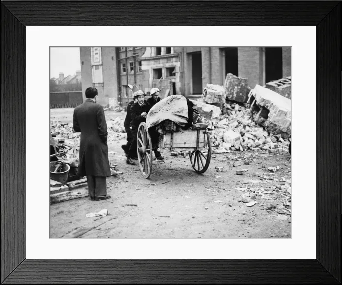 Framed Print : A. R. P. workers taking away childrens belongings from a bombed school in Sandhurst Framed Print : A. R. P. workers taking away childrens belongings from a bombed school in Sandhurst